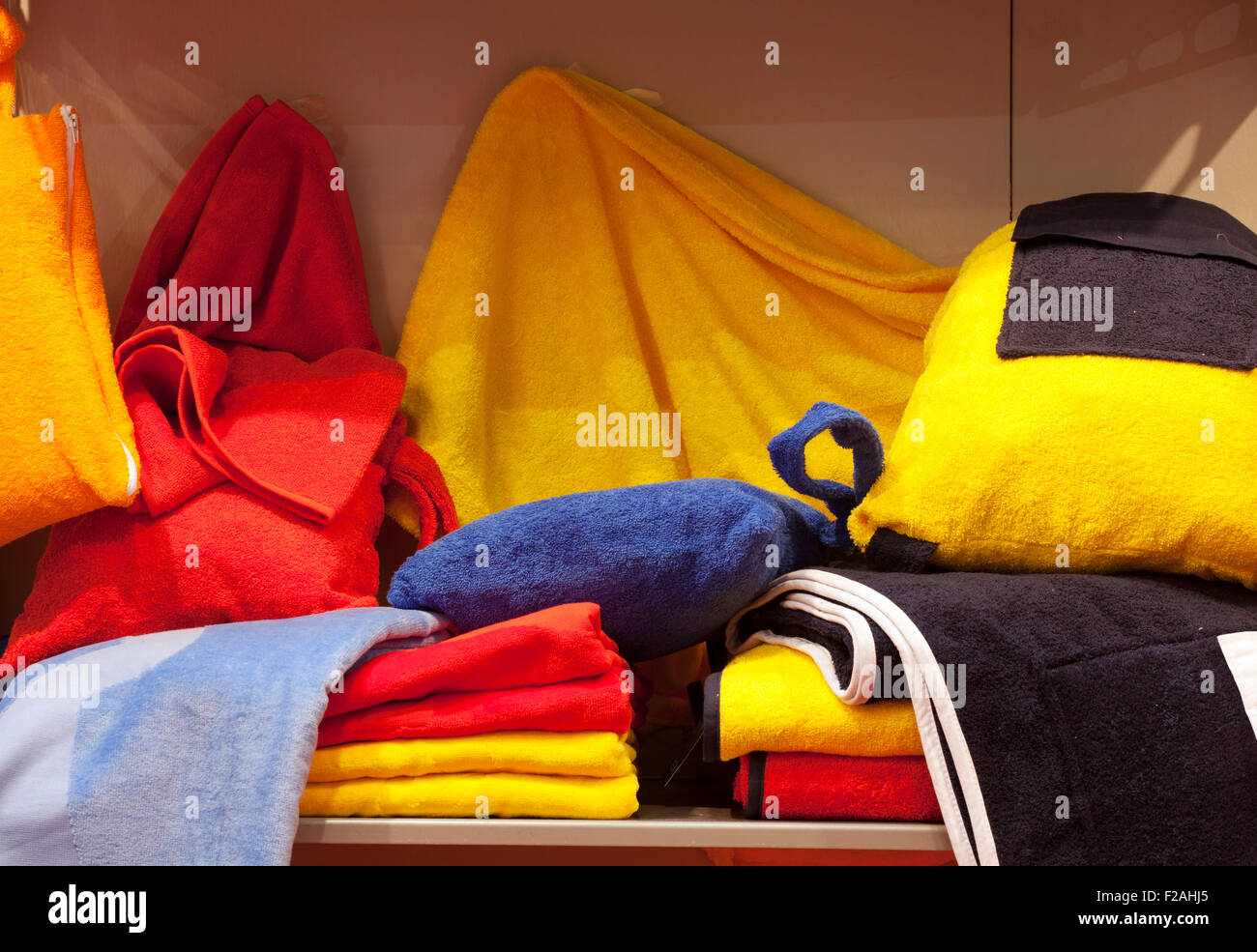 Colorful bathrobe and towels in a shop Stock Photo Alamy