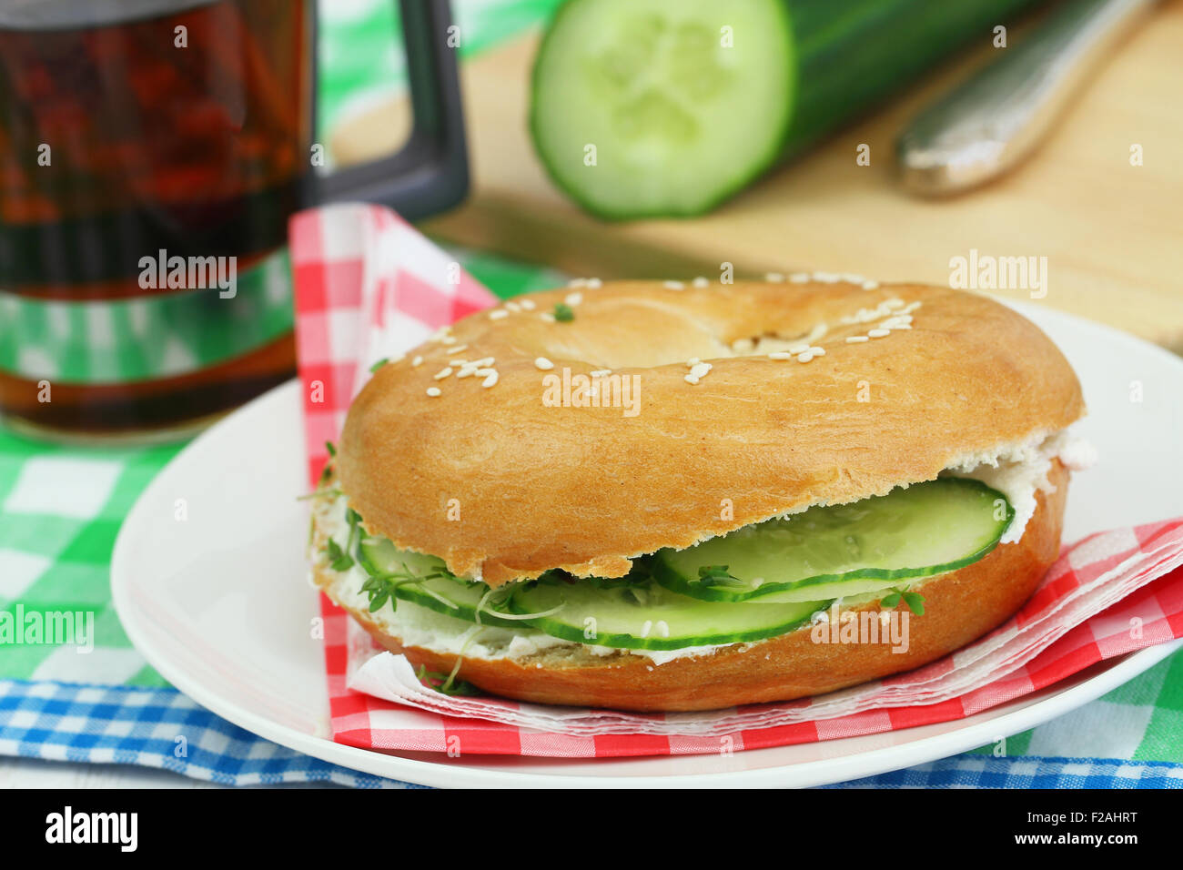 Bagel with cream cheese and cucumber Stock Photo Alamy