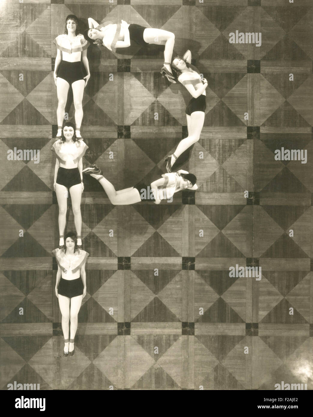 High angle view of women forming the letter 'P' (OLVI007 OU796 F) Stock Photo