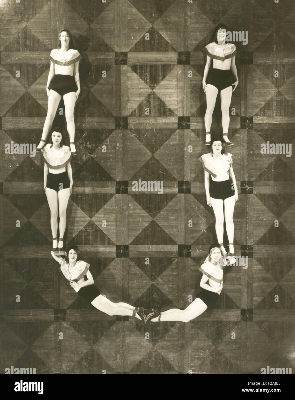 High angle view of women forming the letter 'U' (OLVI007 OU793 F) Stock Photo
