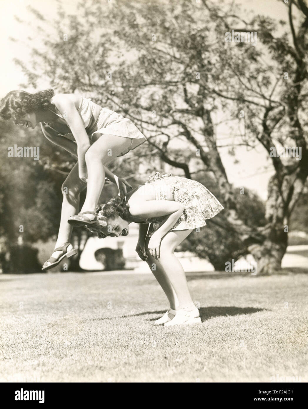 Playing leap frog (OLVI007 OU749 F) Stock Photo