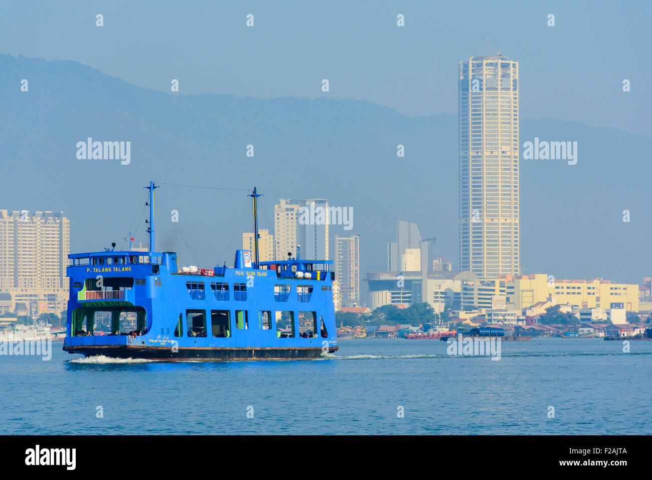 Ferry and KOMTAR Tower of Penang Stock Photo