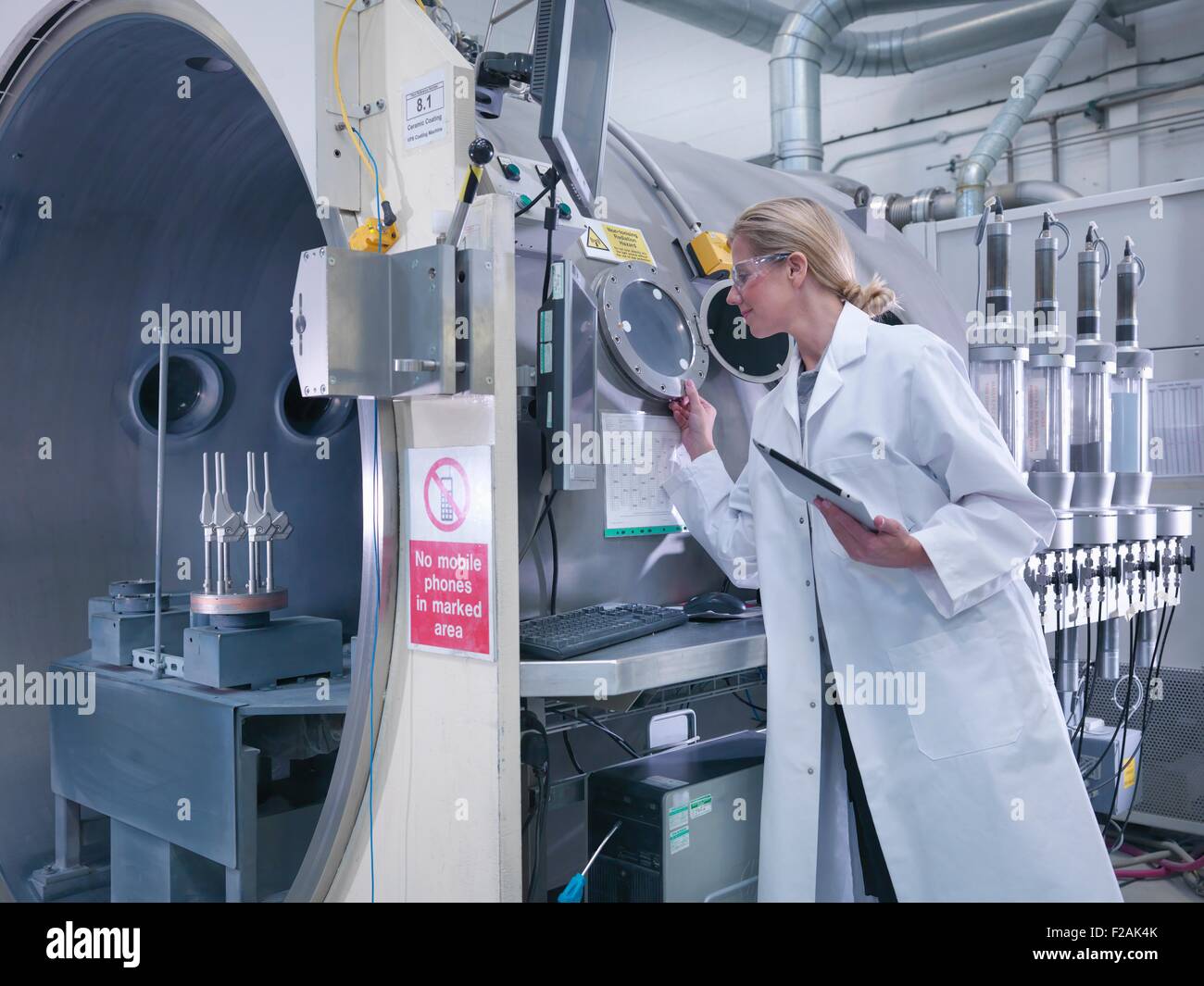 Female engineer with ceramic coating machine, coating artificial hip joints  in orthopaedic factory Stock Photo - Alamy