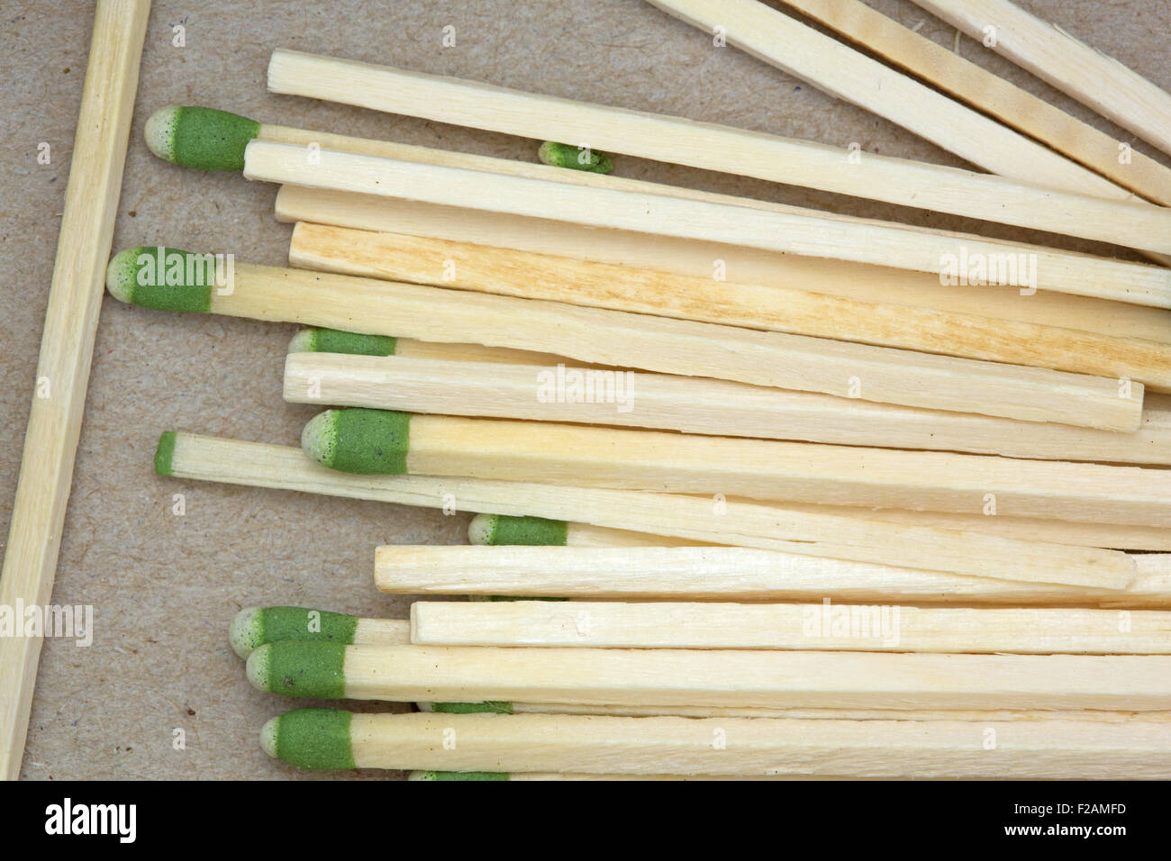 Top close view of large kitchen matches in the bottom of a cardboard box. Stock Photo