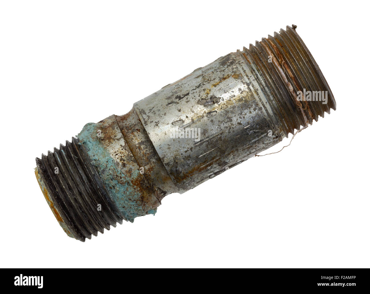 Top view of an old and leaking short pipe nipple with remains of pipe thread compound on a white background. Stock Photo