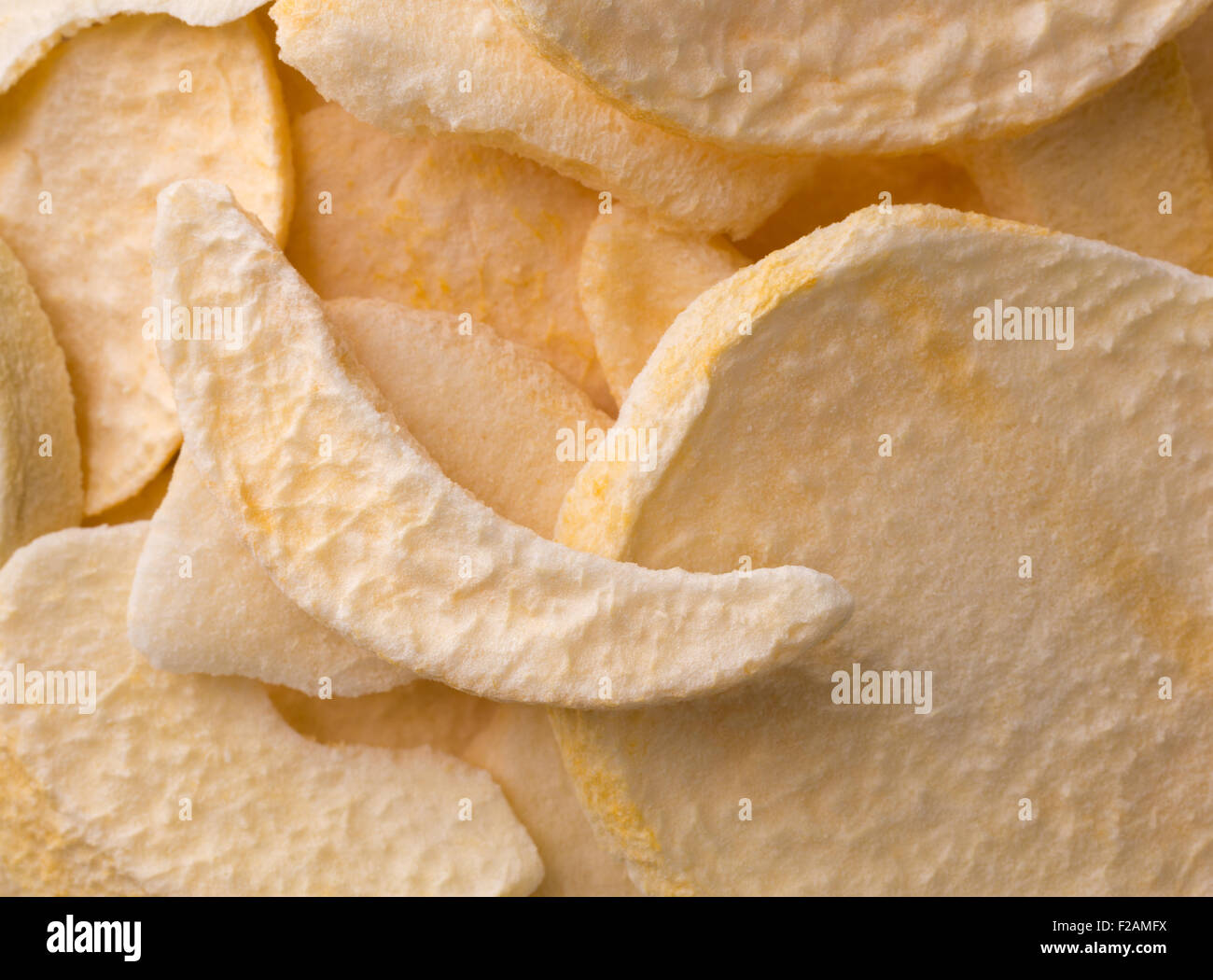 A very close view of dried peach slices illuminated with natural light