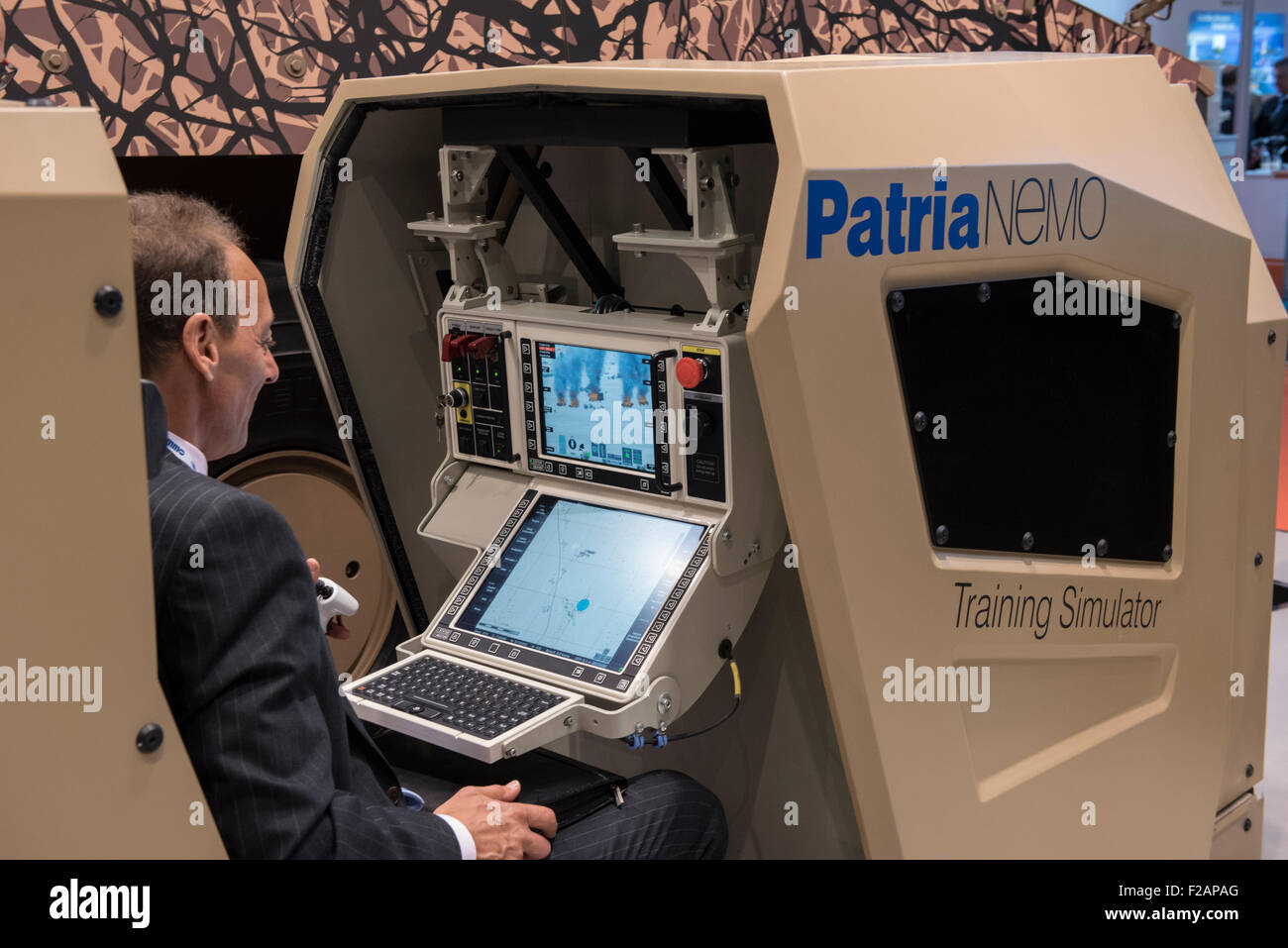 London, UK. 15th September, 2015. A man sits in a training simulator at DSEI, the world’s largest international defence & security exhibition held at London’s ExCel centre. Credit:  Peter Manning/Alamy Live News Stock Photo