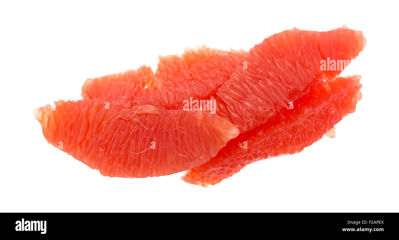 Sections of red grapefruit isolated on a white background. Stock Photo