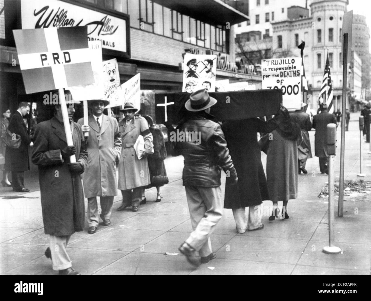 Dominican pickets demonstrated against the visit of Dictator Rafael Trujillo to U.S. Jan. 11, 1953. They carry a black coffin and signs near the Mayflower Hotel, Washington, D.C. One sign reads 'Trujillo is responsible for DEATHS of 70,000,' referring to Parsley Massacre of Haitians in 1937. (CSU 2015 11 1707) Stock Photo