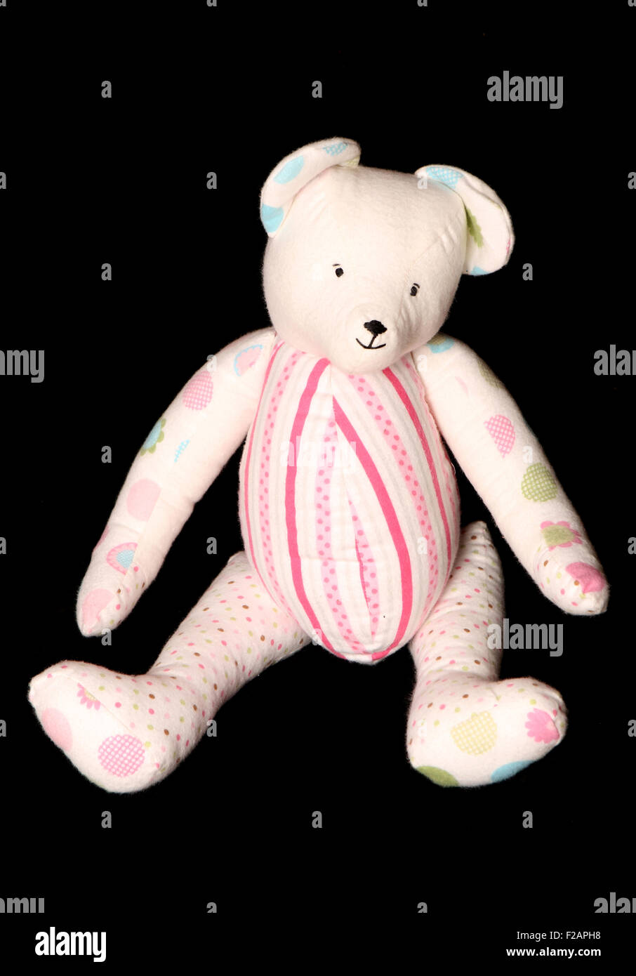 handmade floral teddybear soft toy on black background Stock Photo