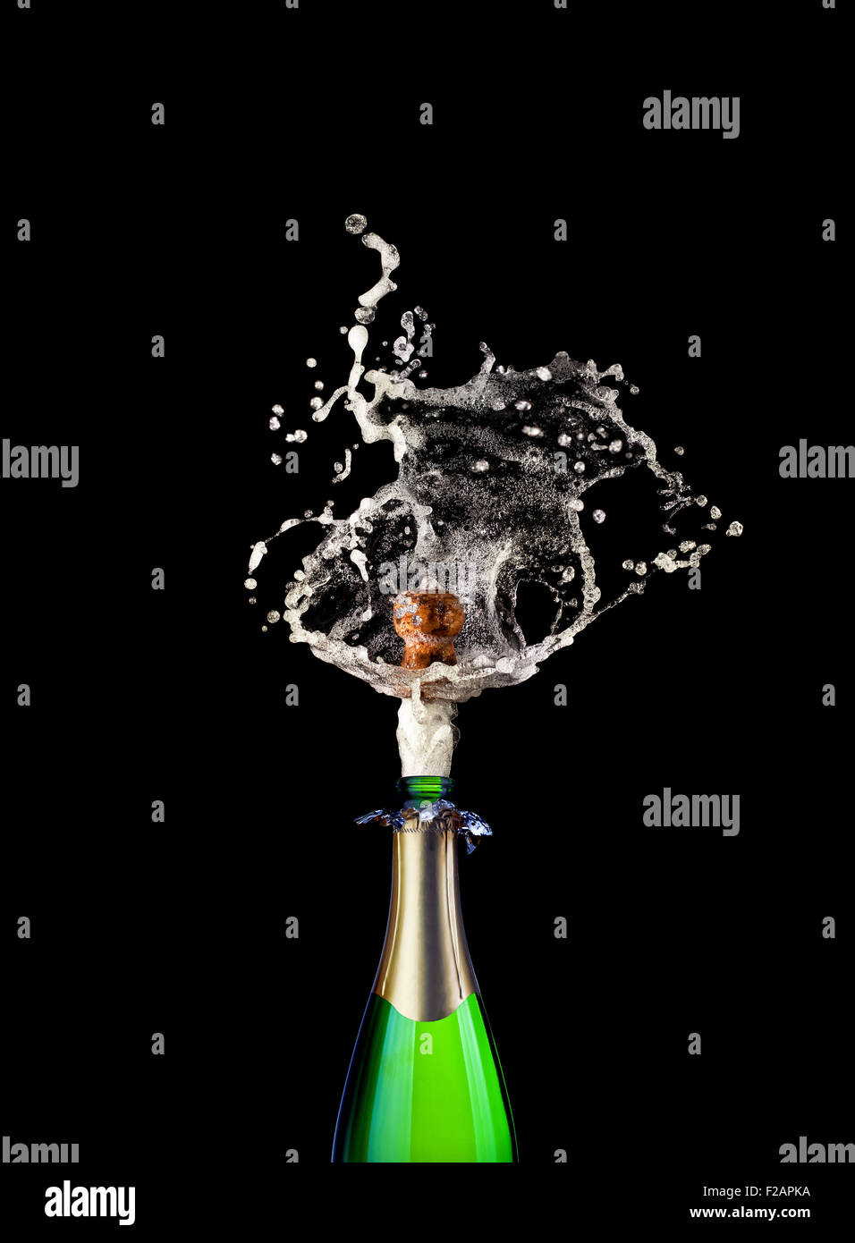 detail of popping champagne on black background Stock Photo