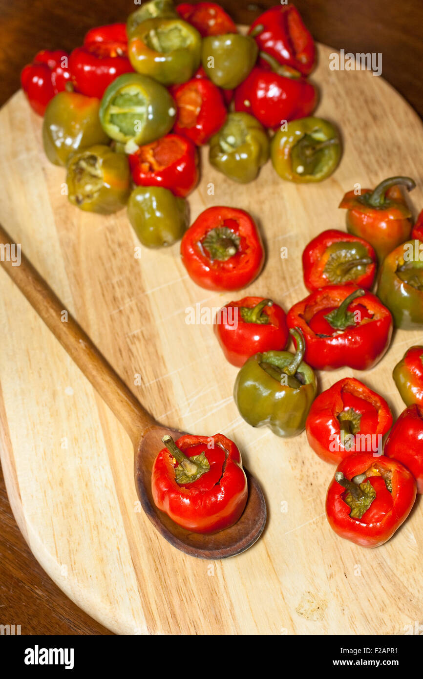 Red hot chili peppers on cutting board Stock Photo - Alamy