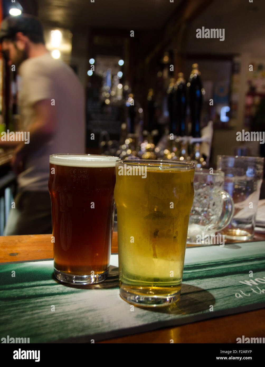 A pint of English beer and a pint of cider in Portcullis Pub, Clifton, Bristol, England, UK