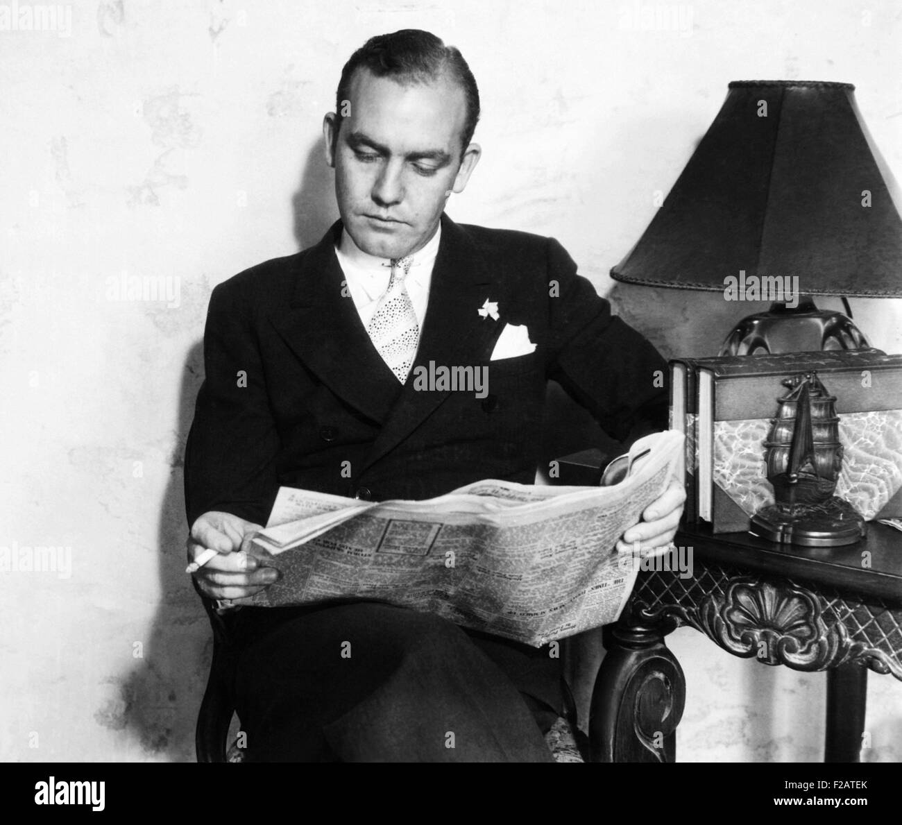 Jean Harlow's ex-husband, the wealthy Charles F. McGraw, reads of Paul Bern's death. Sept. 8, 1932. Harlow was almost 18 when she married the 20 year old McGraw. The couple moved to Beverly Hills, and Harlow was drawn into the movies, stressing her marriage. The couple divorced in 1929. (CSU 2015 11 1677) Stock Photo