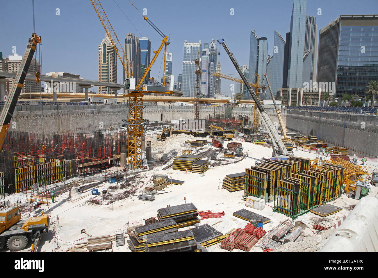 Construction yard with materials and working machines Stock Photo Alamy