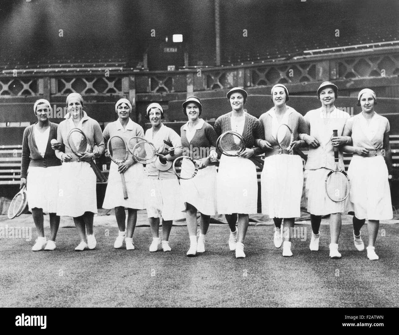 Wightman Cup teams at Wimbledon during a practice session on June 17, 1932. L-R: Helen Jacobs; Betty Nuthall; Anna McCune Harper; Phyllis Mudford King; Sarah Palfrey; Eileen Bennett Whittingstall; Peggy Saunders Mitchell; Helen Wills Moody; Dorothy Round. The Wightman Cup was an annual team tennis competition for women from the United States and Great Britain, 1923-1989. (CSU 2015 11 1579) Stock Photo