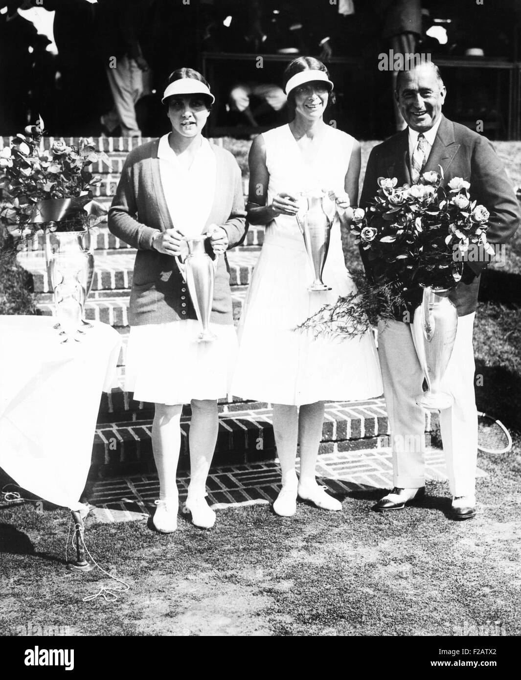 Helen Wills (left), won the Woman's Singles U.S. Lawn Tennis Championship, Aug. 1929. British Phoebe Watson, was runner-up to Miss Wills. Samuel Collum, Pres. U.S. Lawn Tennis Association presented the trophies. (CSU 2015 11 1571) Stock Photo