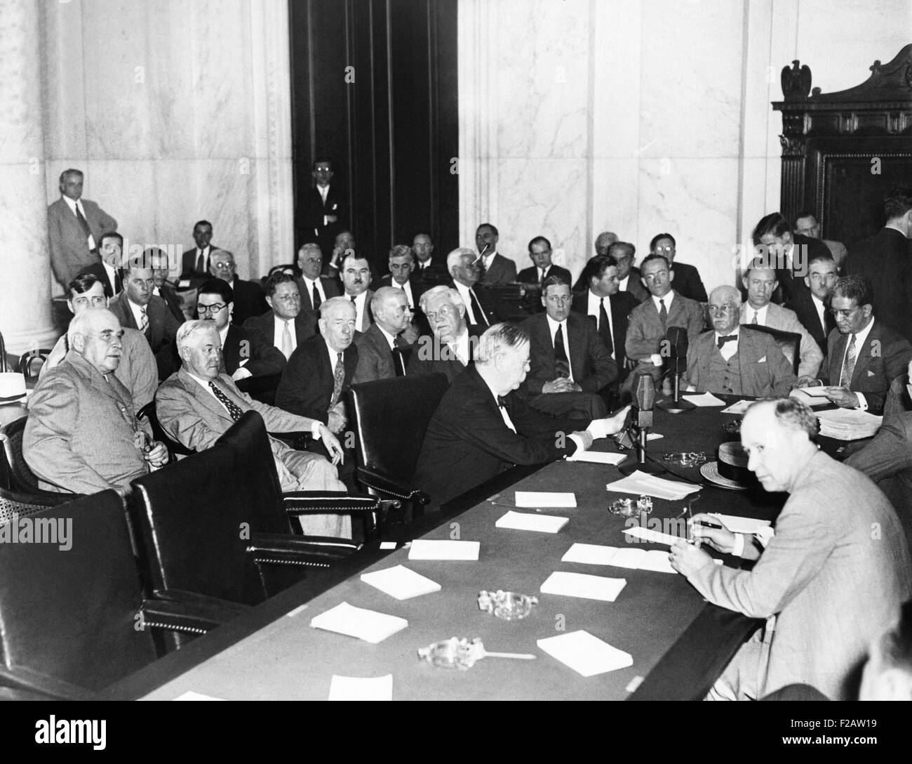The witnesses and Senators at the Senate Banking and Currency Committee hearing. May 26, 1933. J.P. Morgan was seated at far left in the Caucus Room of the Senate Office Building. The committee learned that the Morgan Bank offered stocks at discounted rates to many influential people, including former President Calvin Coolidge and Supreme Court justice Owen J. Roberts. (CSU 2015 11 1501) Stock Photo
