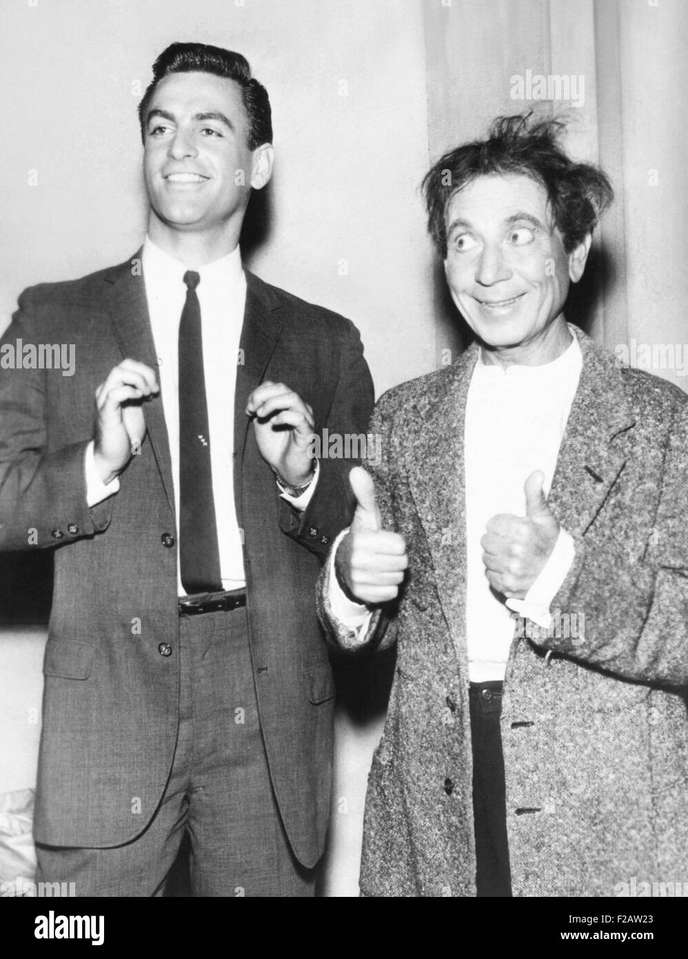 Harpo Marx gives a double thumbs up for his son, Bill. Jan 1961. Harpo and his wife actress Susan Fleming adopted four children: Bill, Alex, Jimmy, and Minnie. In 2008, Bill Marx's published his memoir, SON OF HARPO SPEAKS. (CSU 2015 11 1484) Stock Photo