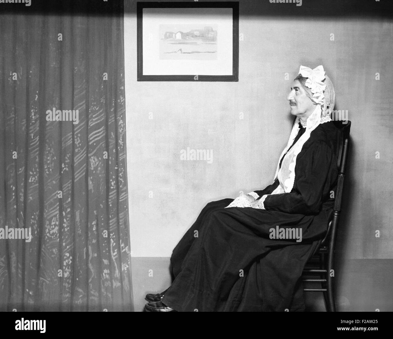 On his rocker, instead of off, is Groucho Marx posing as Whistler's Mother. 1960. (CSU 2015 11 1482) Stock Photo