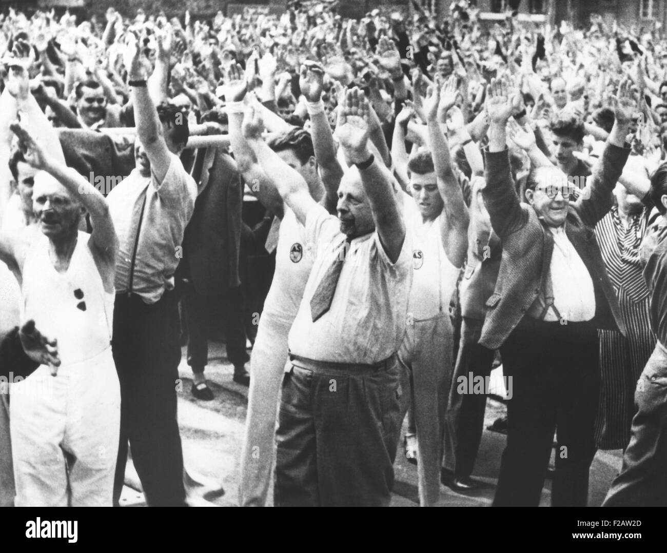 East German Communist President Walter Ulbricht (center, wearing necktie) leading a mass exercise. Aug. 20, 1959. They were celebrating the opening of a new sports field in Leipzig built with 1850 hours of volunteer labor. (CSU 2015 11 1475) Stock Photo