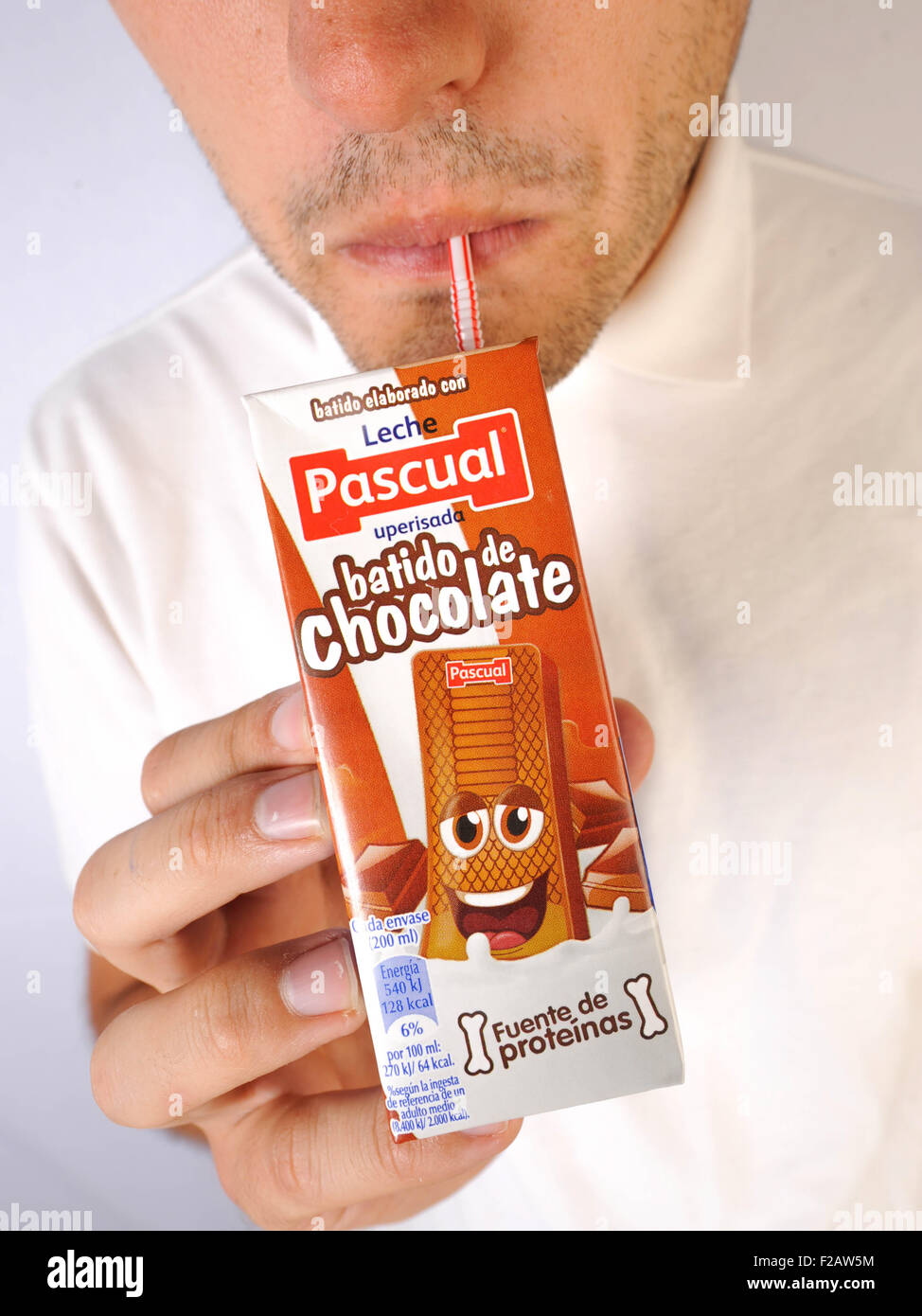 drinking Chocalate Milkshake of Pascual- bebiendo batido de chocolate de Pascual leche uperisada Stock Photo