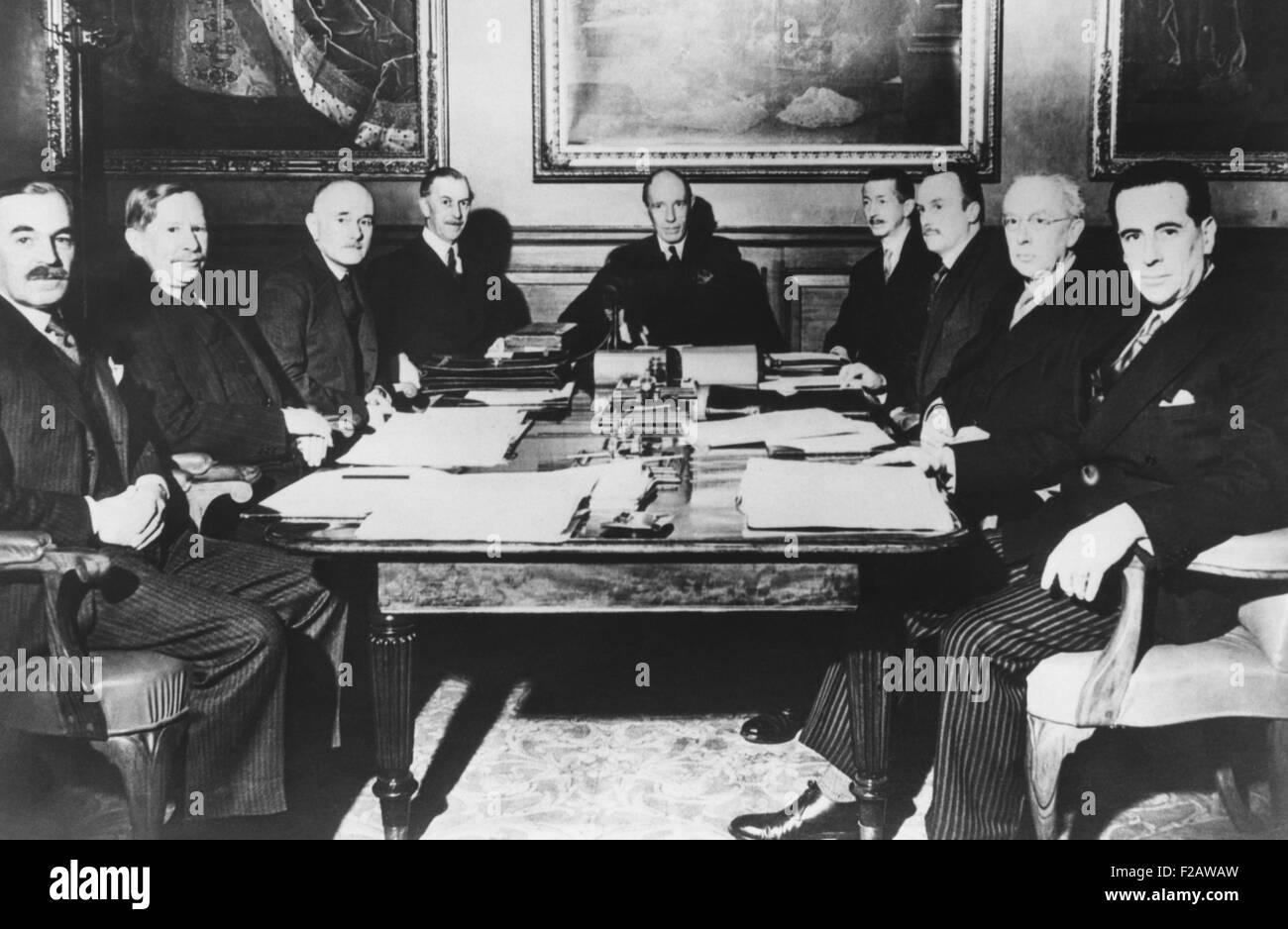 Lord Halifax, Foreign Secretary in Neville Chamberlain's Cabinet presiding over a meeting. April 16, 1940. He met with Britain's ambassadors to plan for a diplomatic and economic offensive against Germany. Halifax favored a negotiated a peace settlement with Hitler, but within a month Winston Churchill was Prime Minister. L-R: Donald Campbell, Yugoslavia; Reginald Hoare, Romania; Hughe Knatchbull-Hugessen, Turkey; Percy Lorene, Italy; Lord Halifax; William Seeds, Soviet Union; Charles Parairet, Greece; Owen St. C. O'Malley, Hungry; George Rendell, Bulgaria. (CSU 2015 11 1446) Stock Photo