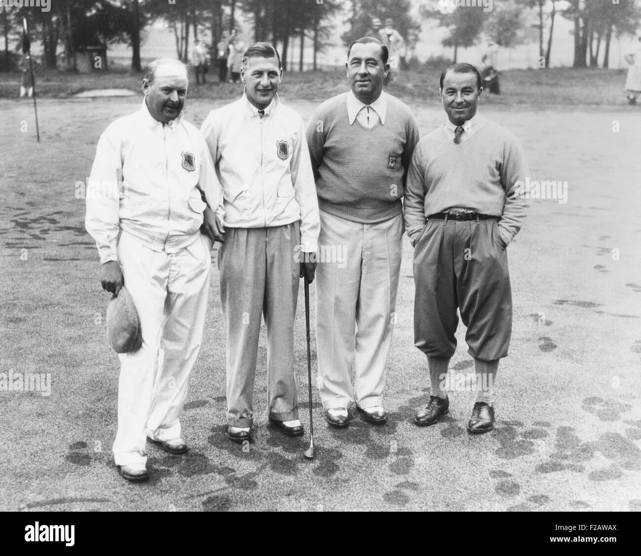 1935 Ryder Cup Scotch foursome. L-R: Alf Perry and John Busson of the British team; and Walter Hagan and Gene Sarazen of the U.S. team. The U.S. team won the semi-annual classic. It was the first of seven consecutive wins by the U.S. side, until the British won in 1957 in England. (CSU 2015 11 1444) Stock Photo