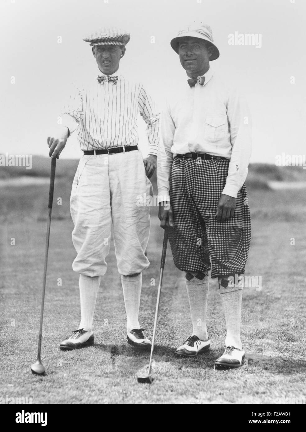 Golfers McDonald Smith and Walter Hagan, at Inwood, Long Island, on July 11, 1923. Hagan wore a tropical pith helmet to cope with the heat. (CSU 2015 11 1443) Stock Photo