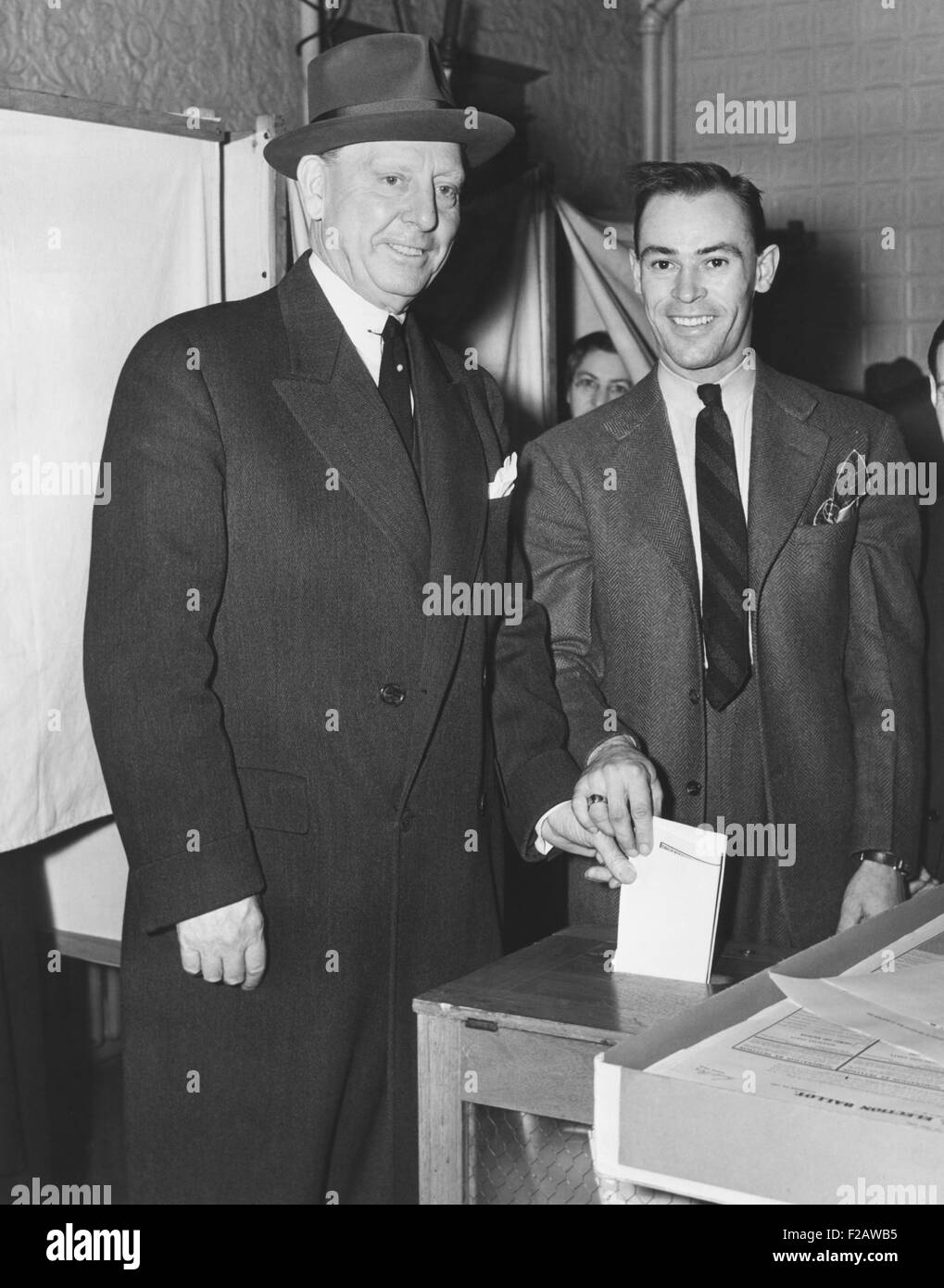 Jersey City Mayor Frank Hagen (left) casting his vote in the general election on Nov. 5, 1941. He was a powerful, entrenched, old style city boss and was Mayor from 1917 to 1947. He had wealth of an estimated $10 million when he retired from a job that never paid more than $8500 annually. (CSU 2015 11 1440) Stock Photo