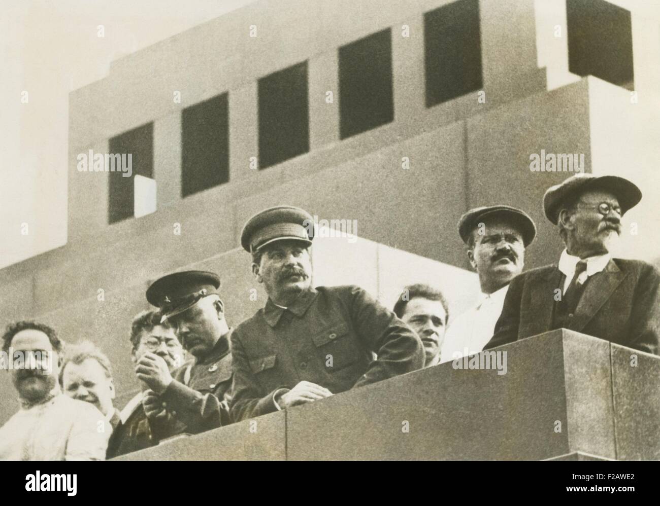 Soviet leaders witnessing the Great Sports Parade of over 100,000 in Red Square, Moscow. June 29, 1933. L-R: Ordzhonikidze, People's Commissar for Heavy Industries; Jaroslawsky (third from Left) member of the Central Control Commission; Voroshiloc, People's Commissar for War and Navy; Stalin, General Secretary of Central Committee of the Communist Party; Molotov (in white jacket), Chairman of the Council of People's Commissars, and Kalinin, Chairman of the Central Executive Committee of the Soviet Union. (CSU 2015 11 1372) Stock Photo