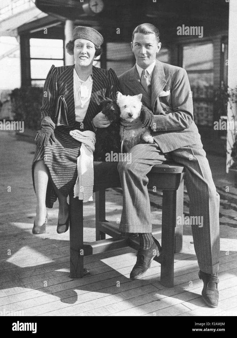 Gloria Swanson with her husband, Michael farmer, her 4th husband. March 16, 1933. They arrived in NYC after she produced the English film, PERFECT UNDERSTANDING. It did not revive her movie career as hoped. Swanson was married to Farmer from 1931 to 1934. They had one child, Michelle Bridget Farmer. (CSU 2015 11 1347) Stock Photo