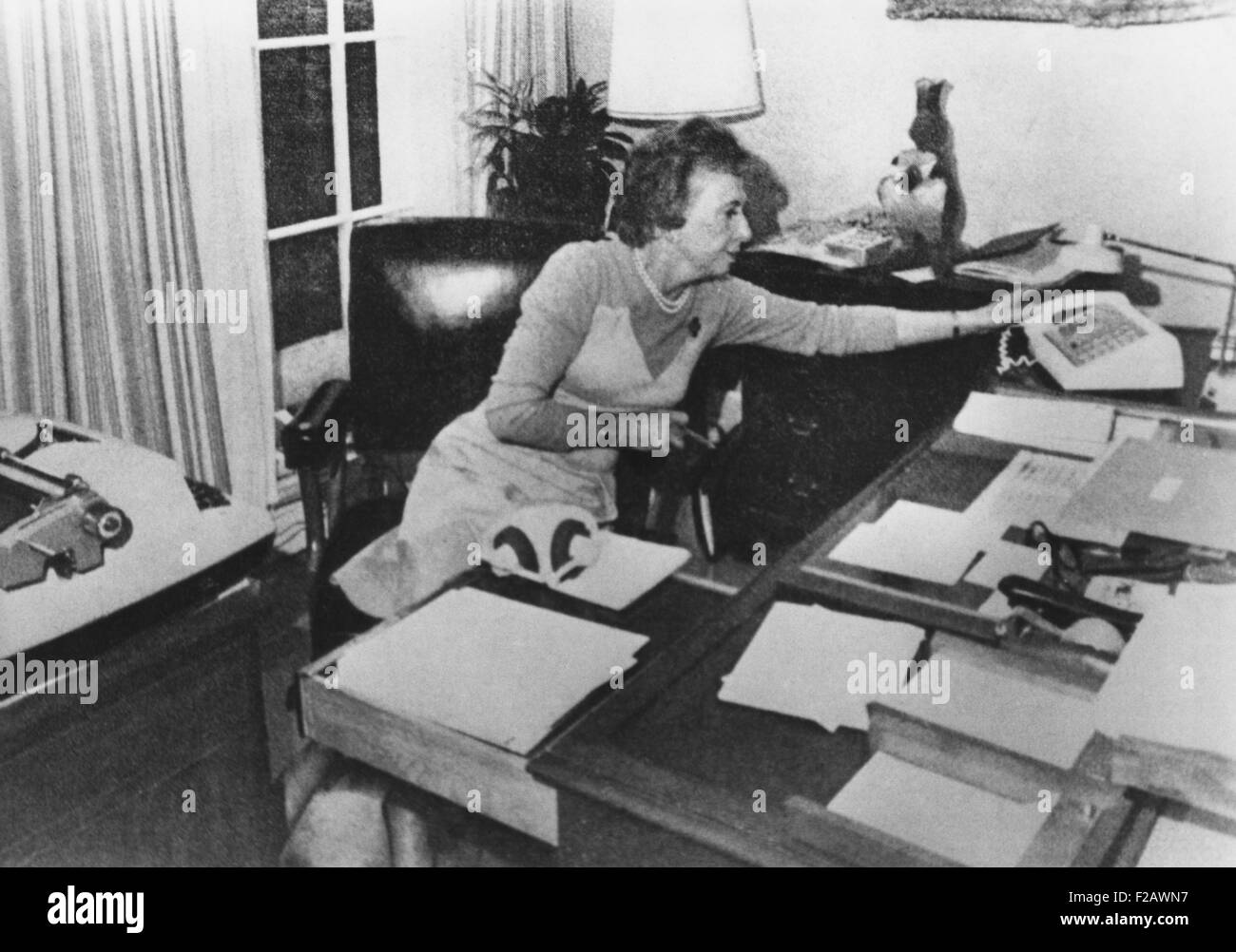 Rosemary Woods, President Nixon's personal secretary, demonstrating the 'Rose Mary Stretch'. She showed photographers how she may have caused the 18 1/2-minute gap in a crucial June 20, 1972 Watergate tape. Ca. Jan. 1974. (CSU 2015 11 1286) Stock Photo