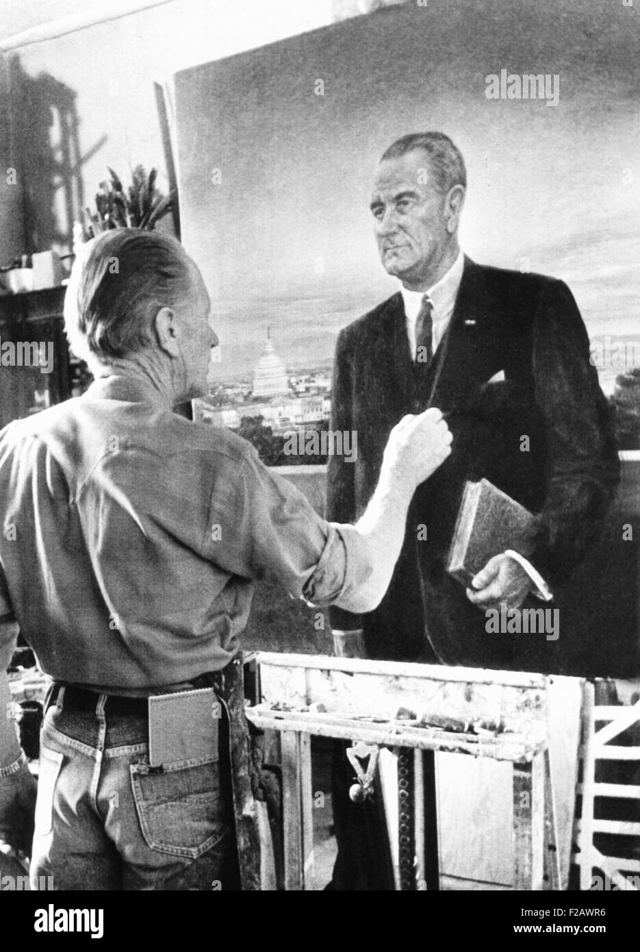 Artist Peter Hurd finishing the official White House portrait of President Lyndon Johnson. Jan. 27, 1966. The painting commissioned by the White House Historical Association was rejects by LBJ, as 'the ugliest thing I ever saw.' It is now in the National Portrait Gallery. (CSU 2015 11 1229) Stock Photo