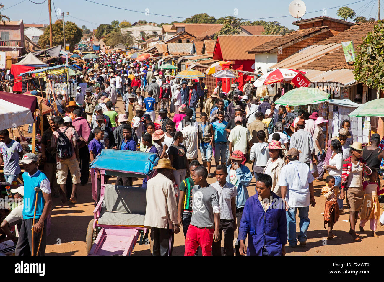 Malagasy people on busy weekly market in rural village near Antsirabe, Vakinankaratra, Madagascar, Southeast Africa Stock Photo