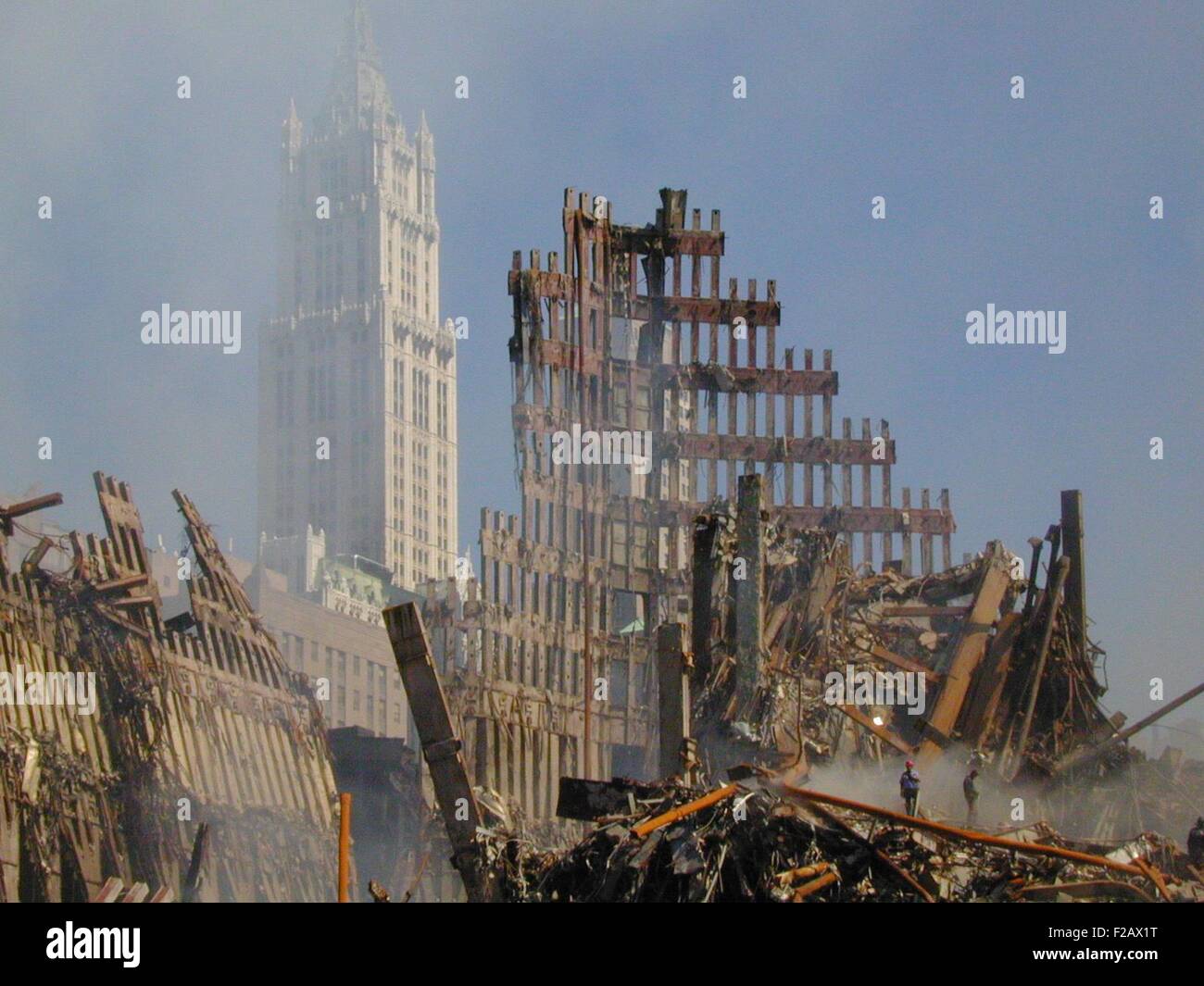 Woolworth Building rises behind the rubble of the collapsed North Tower of the WTC, Sept. 16, 2001. World Trade Center, New York City, after September 11, 2001 terrorist attacks. (BSLOC 2015 2 90) Stock Photo