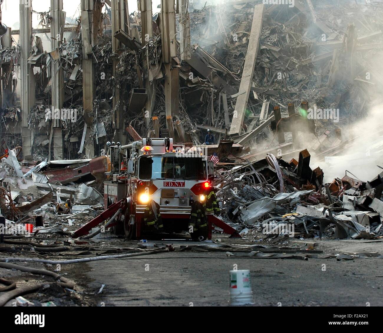 Fire engine by the ruins of the South Tower on Sept 16, 2001. World Trade Center, New York City, after September 11, 2001 terrorist attacks. U.S. Navy Photo by Eric J. Tilford (BSLOC 2015 2 86) Stock Photo