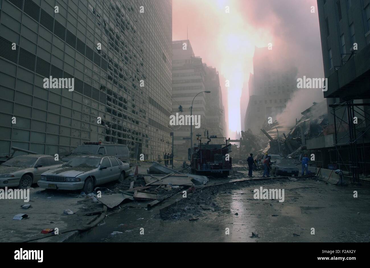 The wreckage of WTC 7, the newest building in the complex which collapsed at 5:20 PM on 9-11. Photo was taken on Barclay Street, looking east toward West Broadway. World Trade Center, New York City, after September 11, 2001 terrorist attacks. (BSLOC 2015 2 69) Stock Photo