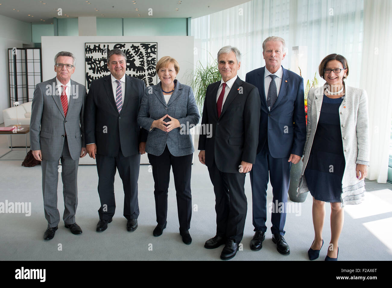 HANDOUT - A handout picture made available by the German Federal Press Office (Bundespresseamt), shows German Chancellor Angela Merkel (CDU - third from left) and Austrian Chancellor Werner Faymann (SPOE fourth from left), at the beginning of a meeting with both countries's ministers: Thomas de Maiziere (Germany, Interior, l), Sigmar Gabriel (Germany, Economy, second from left), Reinhold Mitterlehner (Austri, Economy, fifth from left) and Johanna Miki-Leitner (Austria - Interior, r) at the German Federal Chancellery in Berlin, Germany, 15 September 2015. PHOTO: BUNDESREGIERUNG/GUIDO BERGMANN/D Stock Photo