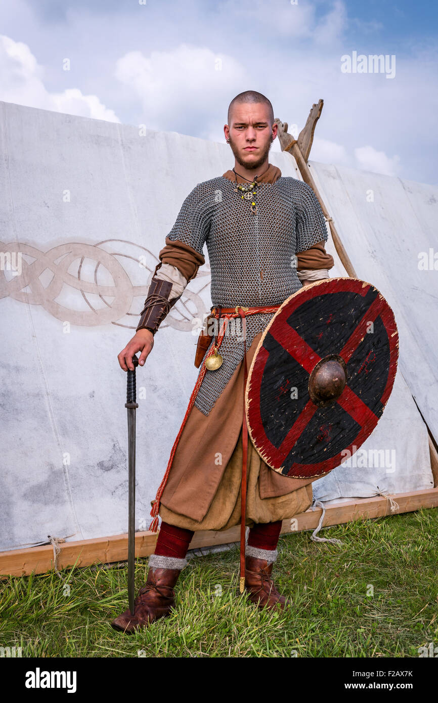 A closeup of a man dressed as a viking with shield and sword, Ishøj
