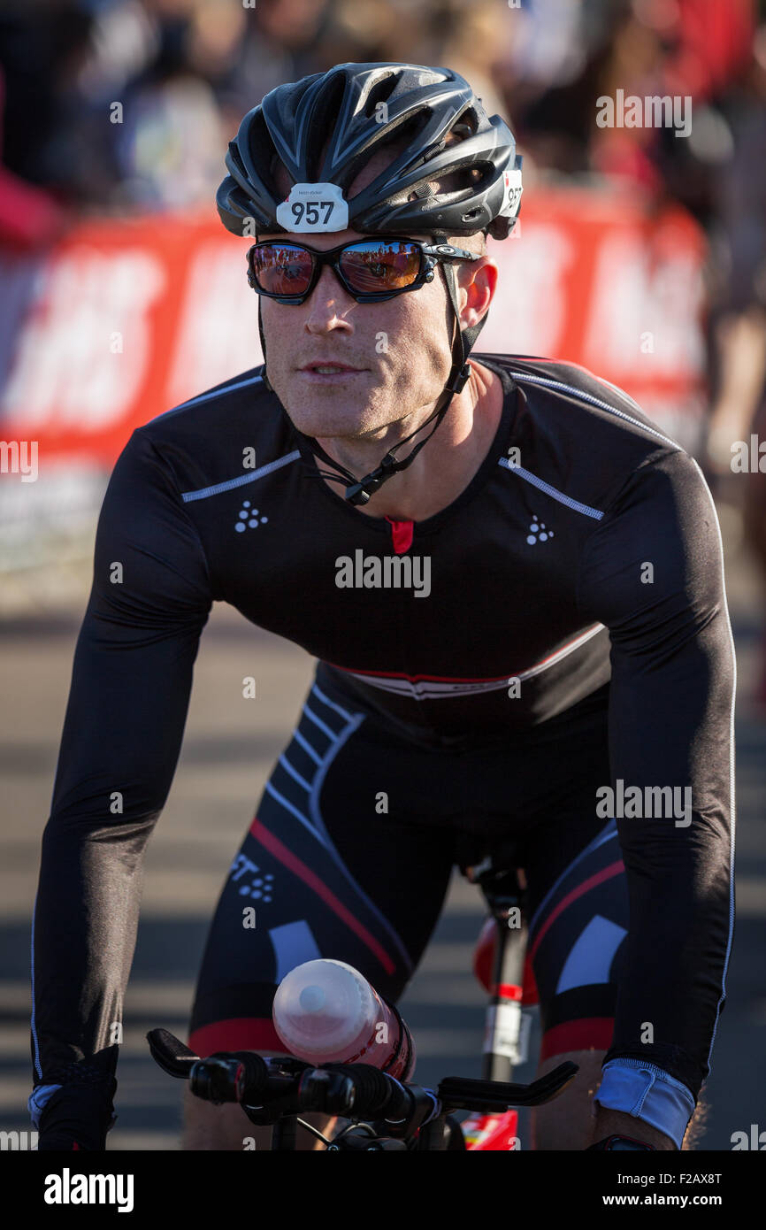 A triathlete has just started on the 180 km cycle stage in KMD Ironman Copenhagen, Denmark Stock Photo