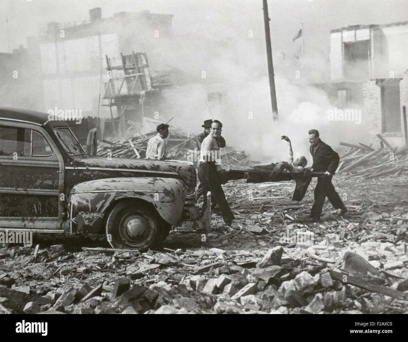 Movie still from a U.S. Army film about a hypothetical attack using an atomic bomb, Nov. 1948. Still shows rescue workers are shown removing the injured from shattered homes. (BSLOC 2015 2 31) Stock Photo