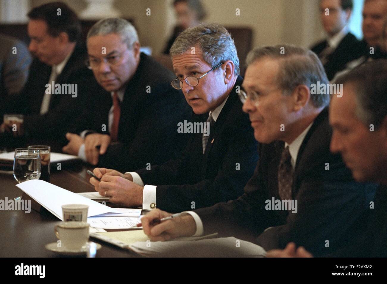 President George W. Bush Meets with his Cabinet on Oct. 10, 2001. Flanking Bush 43 are Sec. of State, Colin Powell (left); and Sec. of Defense Donald Rumsfeld. Operation Enduring Freedom combat in Afghanistan started four days earlier on October 7, 2001. (BSLOC 2015 2 174) Stock Photo