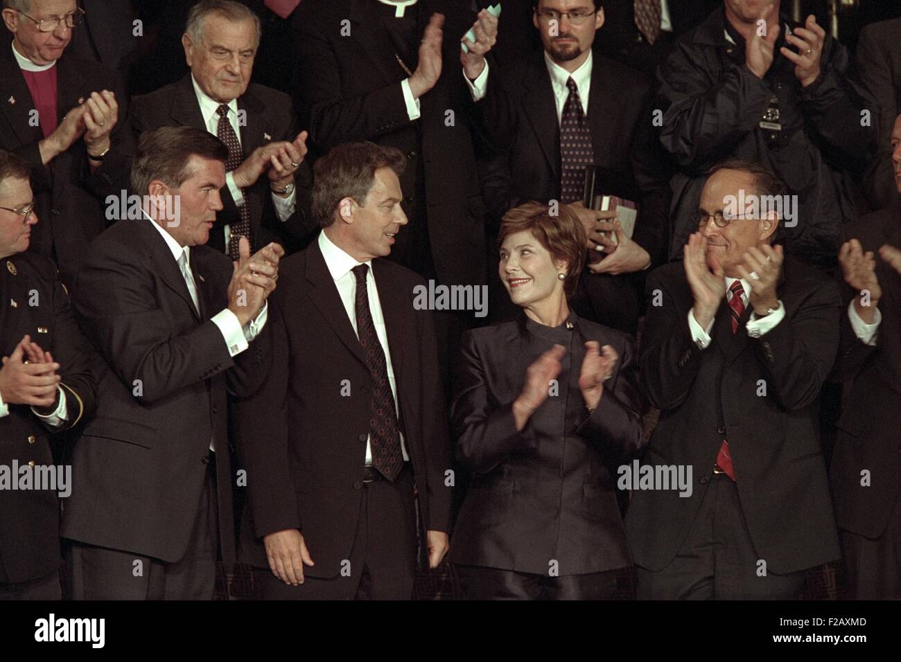 First Lady Laura Bush with Tom Ridge, PM Tony Blair, and NYC Mayor Rudy Giuliani. All three men were mentioned in President George W. Bush's address in which he identified Al Qaeda's responsibility and the Taliban government of Afghanistan as their abettor. Sept. 20, 2001. (BSLOC 2015 2 165) Stock Photo