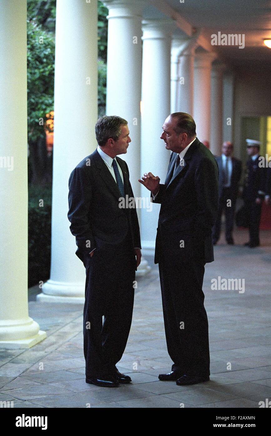 President George W. Bush talks with President Jacques Chirac of France. On the Colonnade at the White House, Sept 18, 2001. Operation Enduring Freedom combat in Afghanistan would start on October 7, 2001. France would be a participant providing troops and other military support. (BSLOC 2015 2 158) Stock Photo