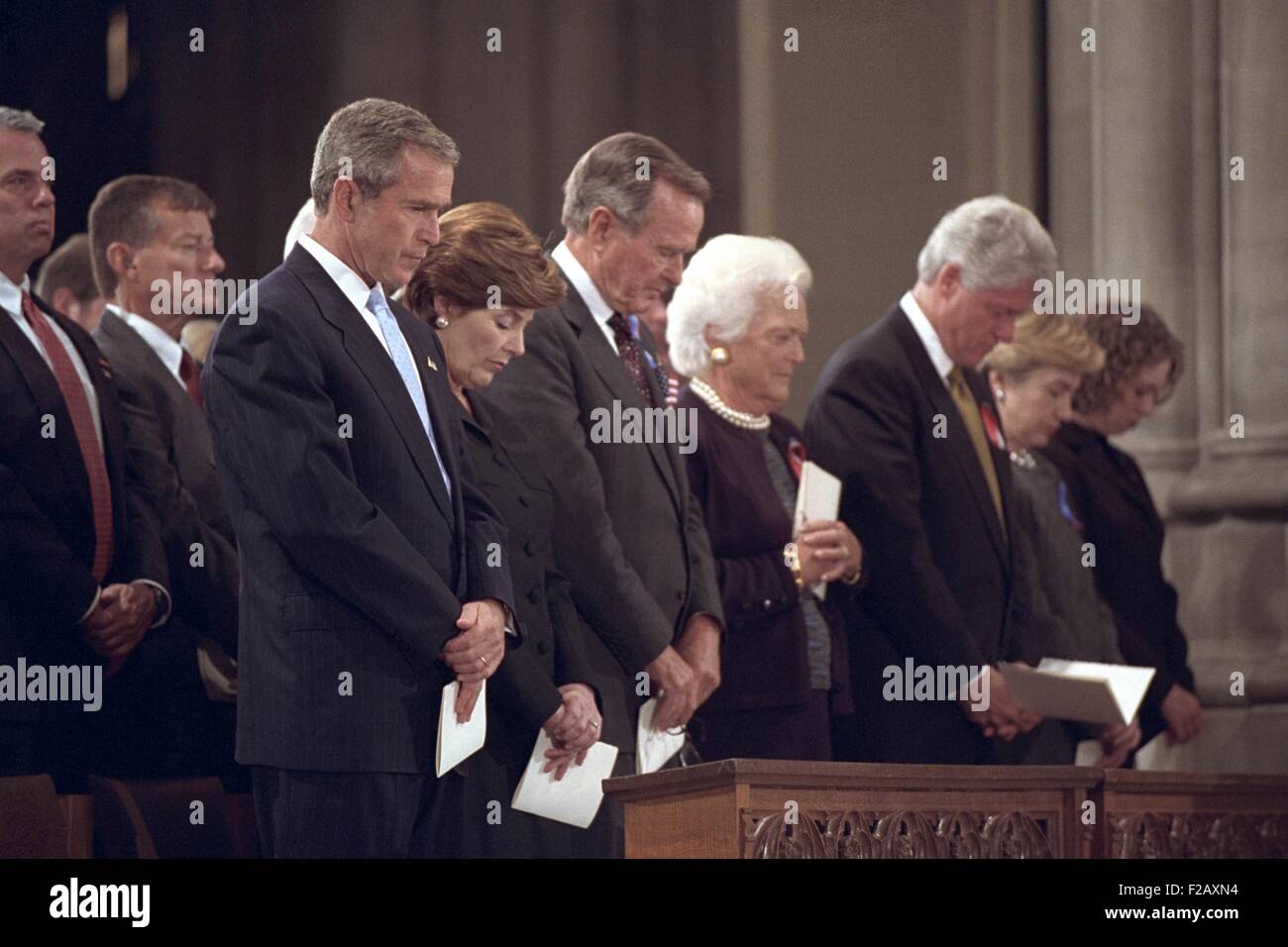 National Day of Prayer and Remembrance service on Sept. 14, 2001. At National Cathedral, L-R: President George W. Bush, Mrs. Laura Bush, Former President George H. W. Bush, Mrs. Barbara Bush, Former President Bill Clinton, Sen. Hillary Rodham Clinton, and Chelsea Clinton. (BSLOC 2015 2 149) Stock Photo