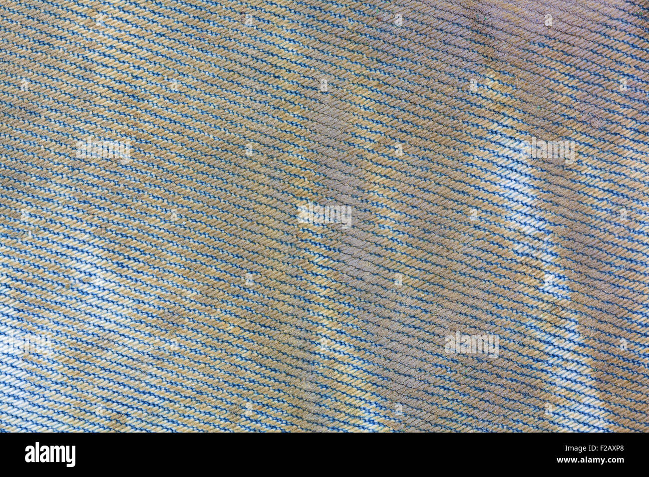 A very close view of muddy and dirty blue jeans. Stock Photo