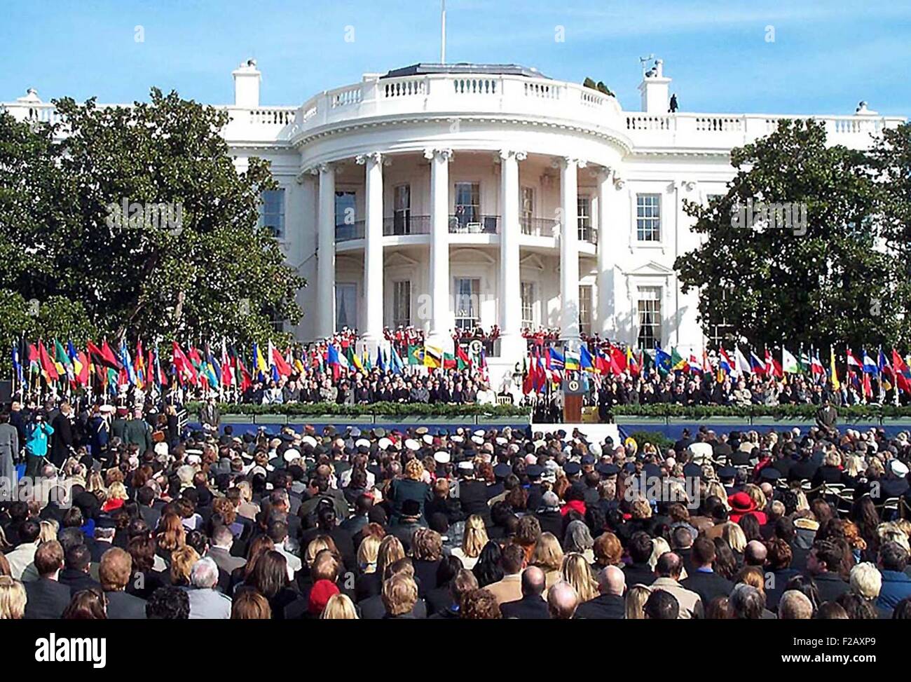 1,000 people at a six-month remembrance of the 9-11 terrorist attacks at the White House. March 11, 2002. In attendance are members from 29 coalition nations in the worldwide fight against terrorism. More than 120 ambassadors, members of Congress, the Bush Cabinet, Supreme Court and armed forces also attended. U.S. Navy Photo by Rudi Williams. (BSLOC 2015 2 122) Stock Photo