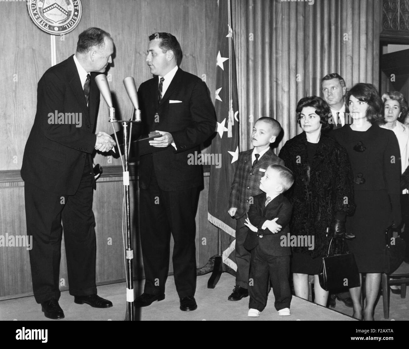 Secret Service agent Clinton Hill receives a citation for 'exceptional bravery'. At the scene of the Kennedy assassination in Dallas. He threw his body in front of the late President Kennedy and First Lady. L-R: Sec. Douglas Dillon, Clint Hill, Hill's sons Chris, 7 and Corey, 2; his wife Gwen, and Mrs. Jacqueline Kennedy. (CSU 2015 9 972) Stock Photo
