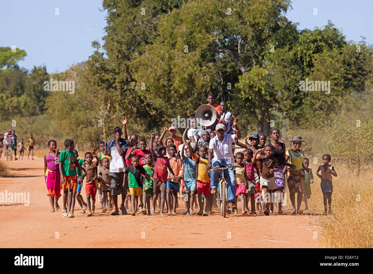 Malagasy children and adults with megaphone promoting their favourite candidate for the elections in Madagascar, Africa Stock Photo